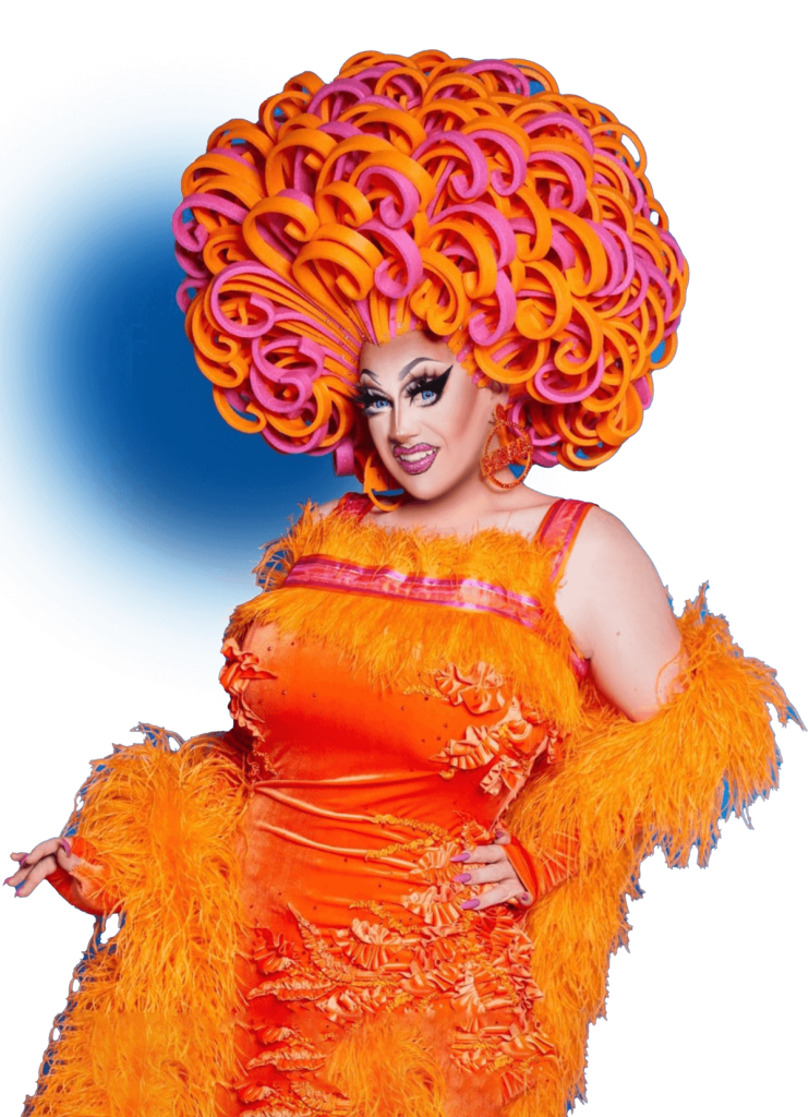 Photo of Kita Mean wearing a fabulous orange and pink "foamy" wig and orange dress
