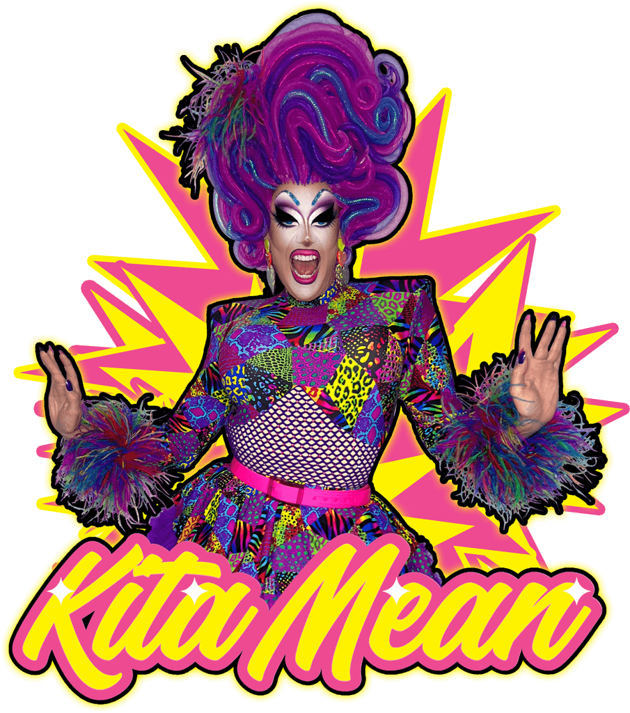 Kita Mean in full drag, with pink and purple wig